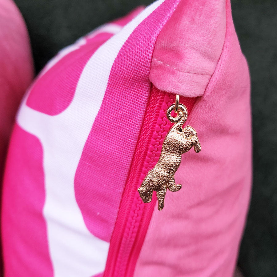 By John Designs white and pink African giraffe pattern scatter cushion with velvet and leopard pendent