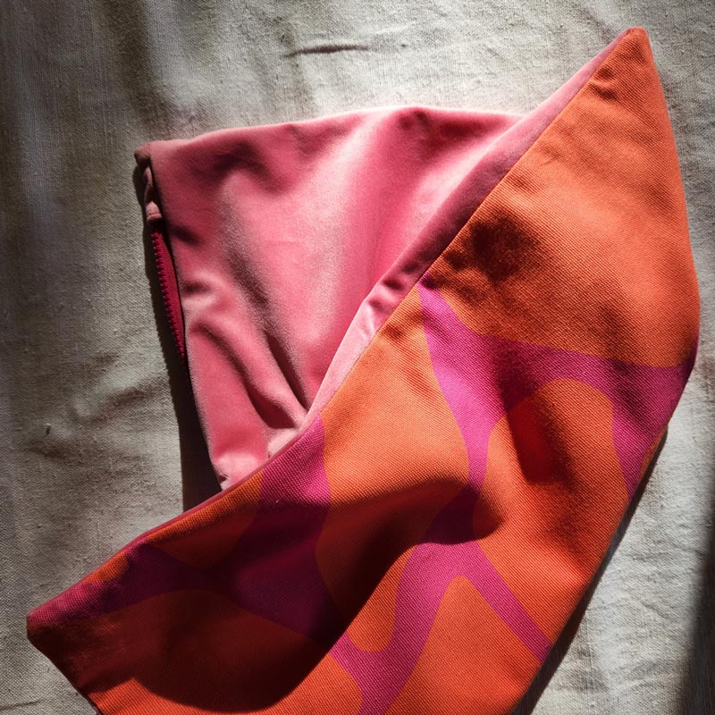 By John Designs red and pink African giraffe pattern scatter cushion with velvet